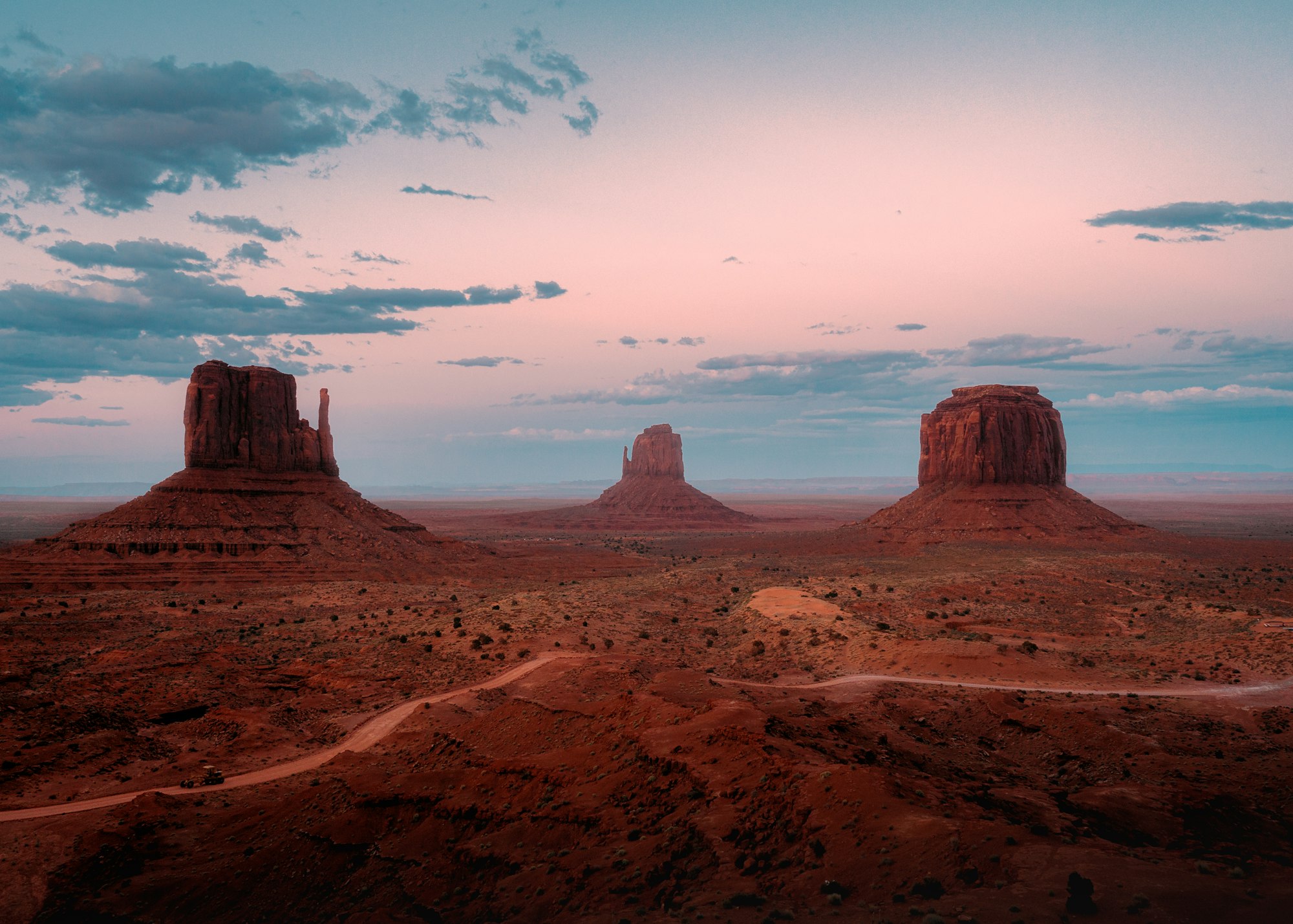 Desert road leading toward mountains in the Morongo Basin