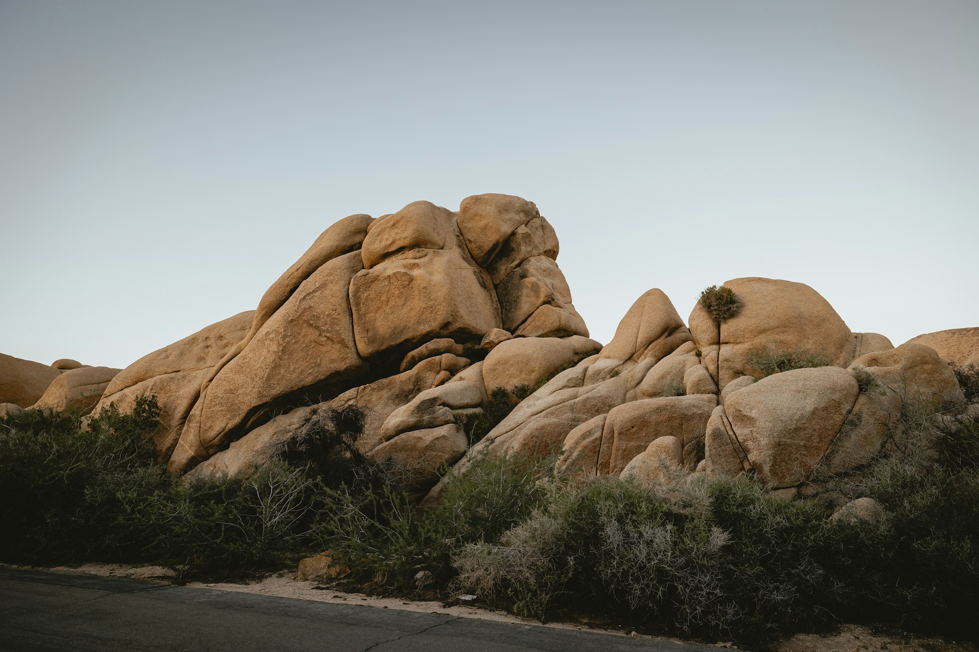 Large rock formations in Joshua Tree National Park desert landscape