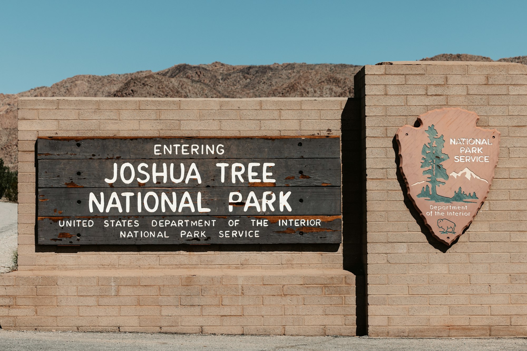 Entering Joshua Tree National Park welcome sign along the highway